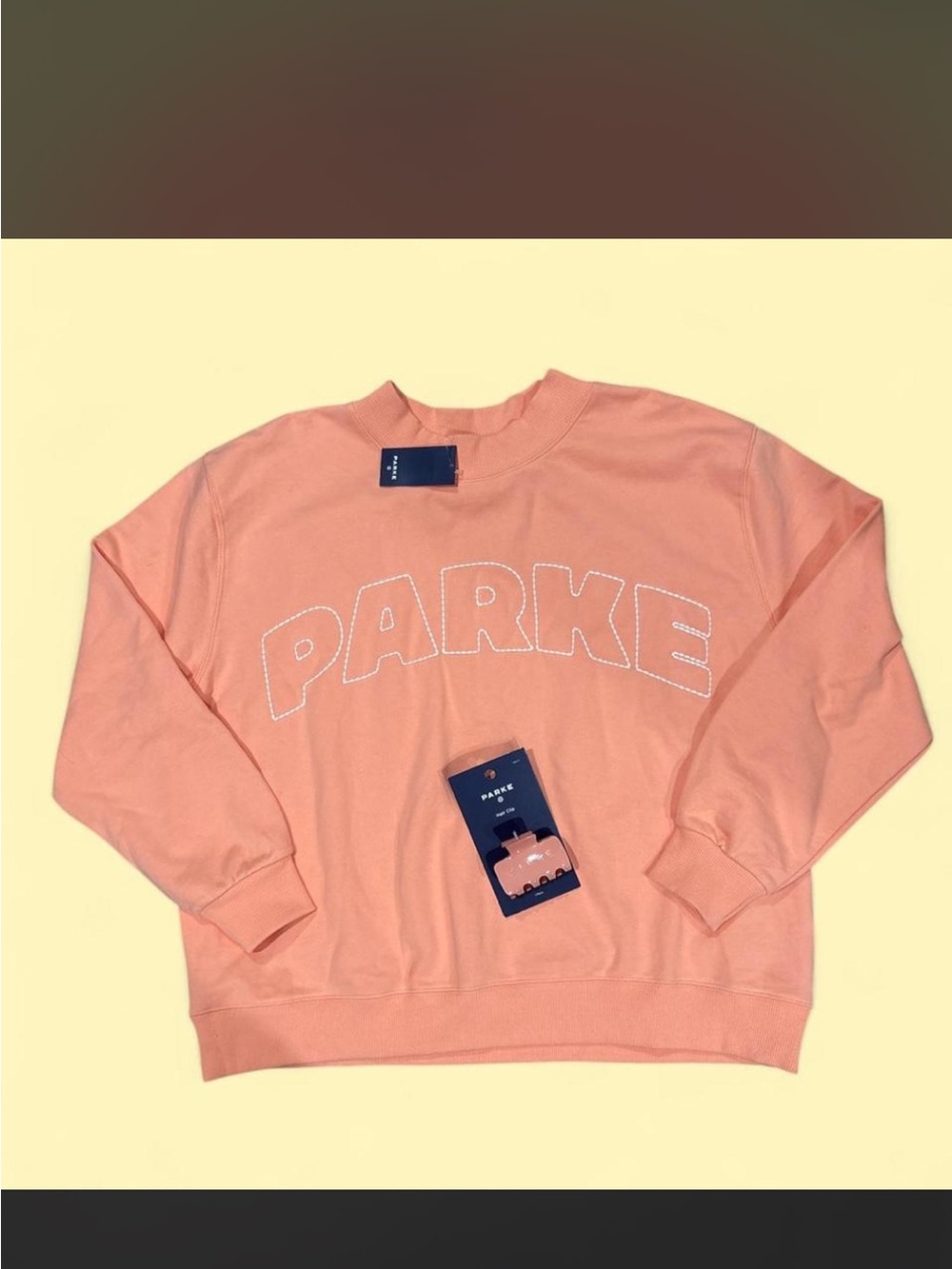 Bundle Parke Women’s Crewneck Sweatshirt and hair clip in Peach